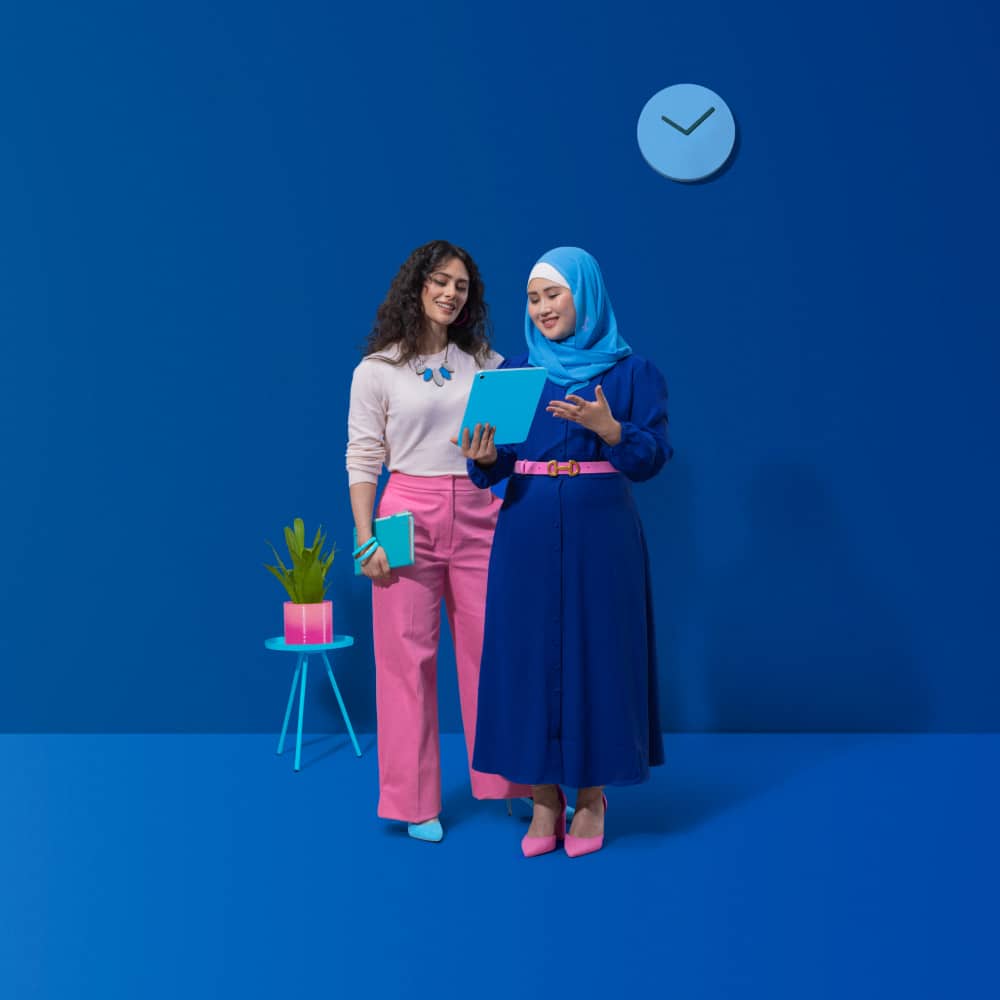 two small business owners looking at an ipad