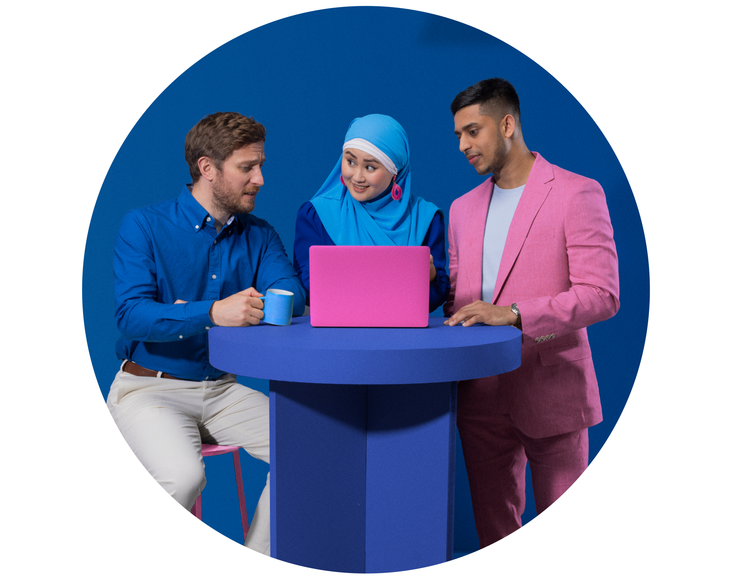 A group standing round a laptop