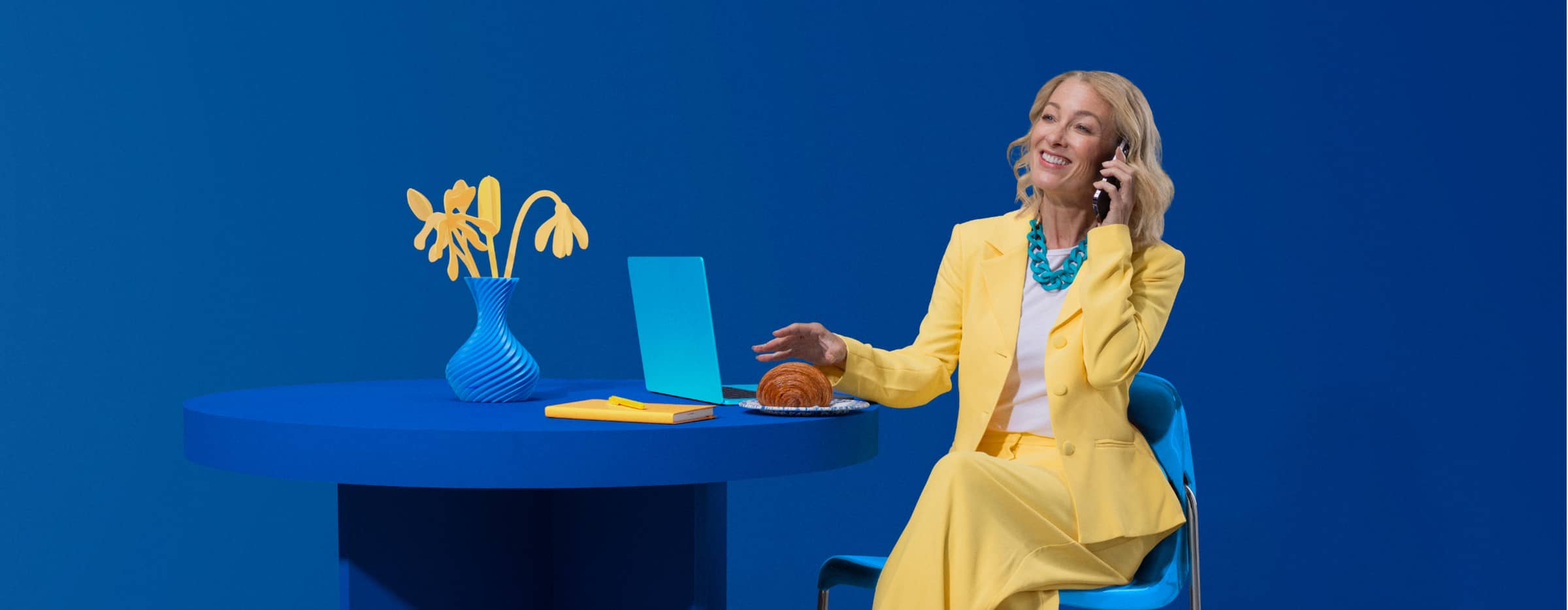 A client smiling ready to scroll through her Xero software while eating breakfast.