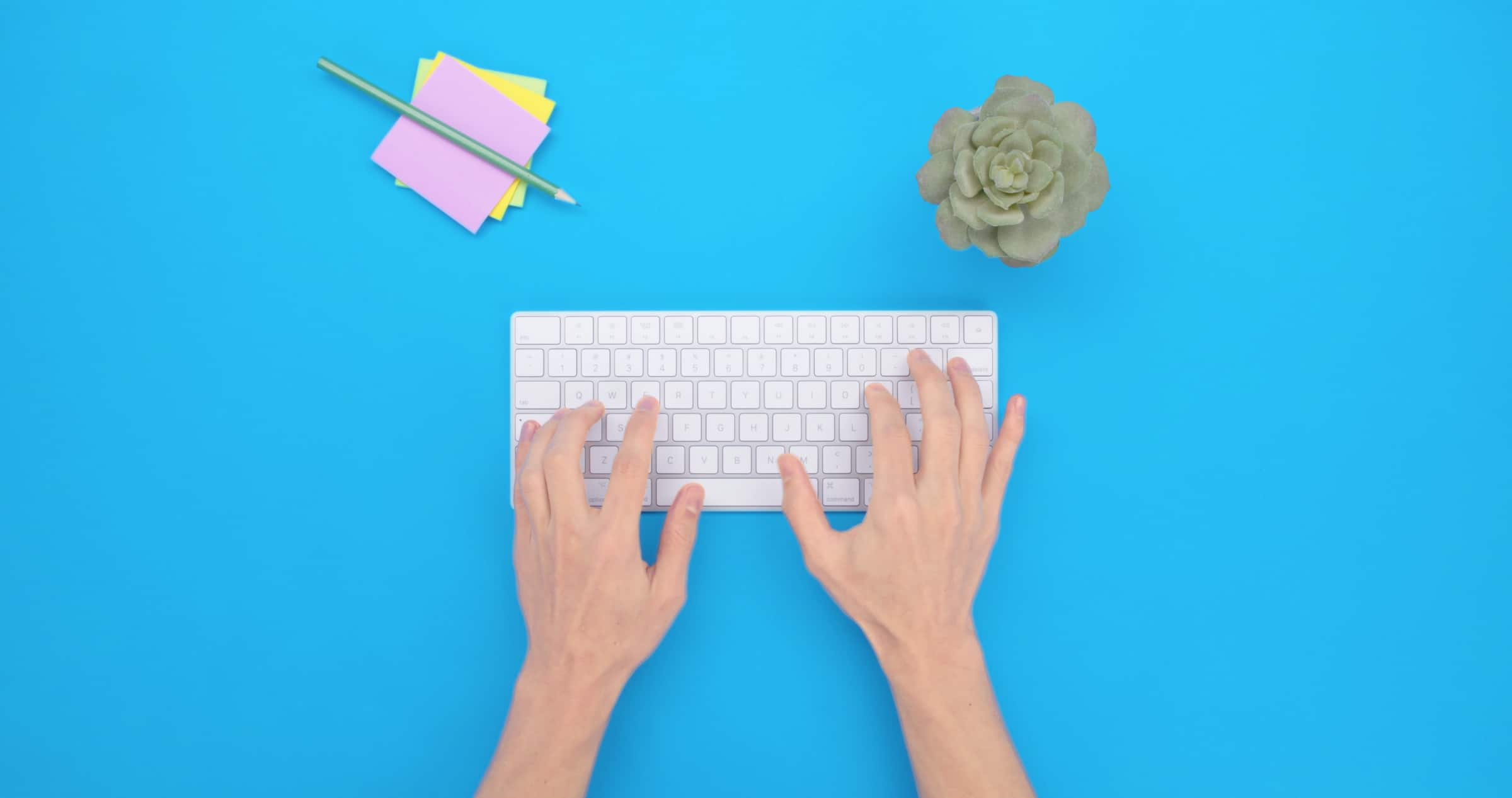 Business owner typing on a keyboard to create a purchase order in Xero