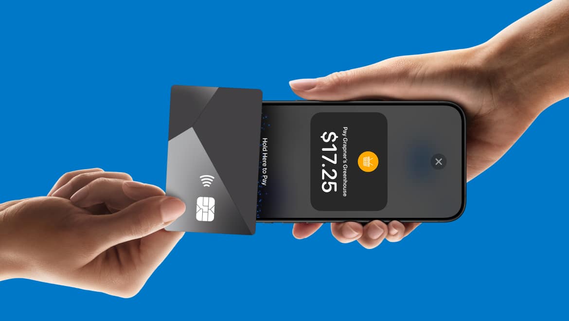 An iPhone taps another device to make payment