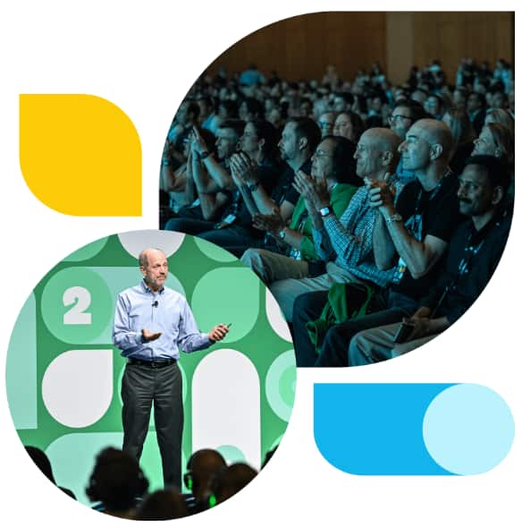 A full auditorium with an audience of accountants and bookkeepers paying close attention to the onstage speaker.