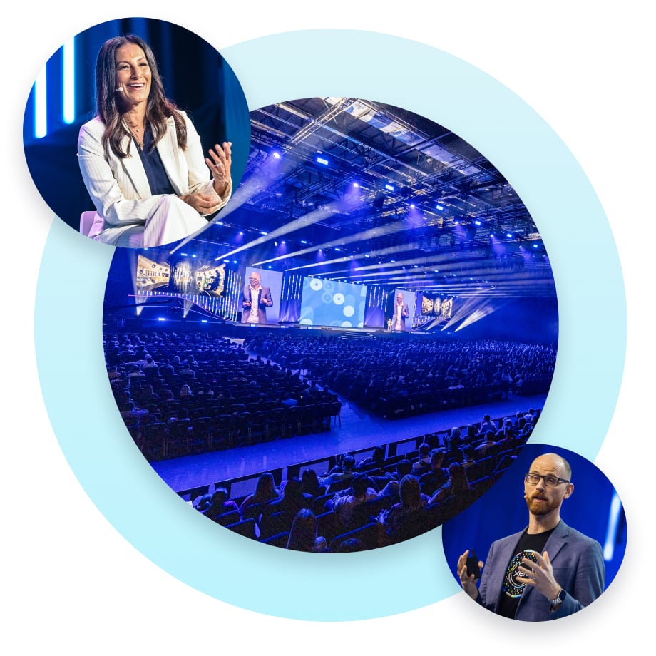 A presentation on the main stage is attended by a full house.